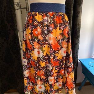 Sheer lularoe lola skirt. Super cute flowers